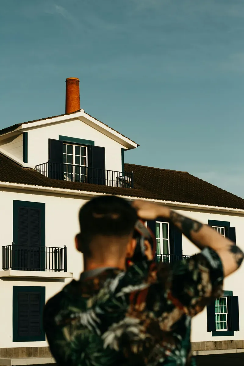 Pest control technician inspecting a house